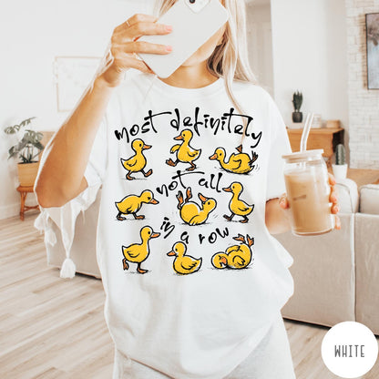 Comfort Colors tee in White featuring whimsical duck graphic with text most definitely not all in a row.