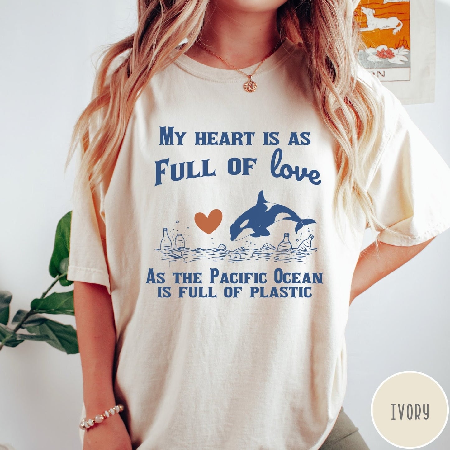 Comfort Colors tee in Ivory featuring screen printed orca and plastic pollution graphic with ocean conservation text