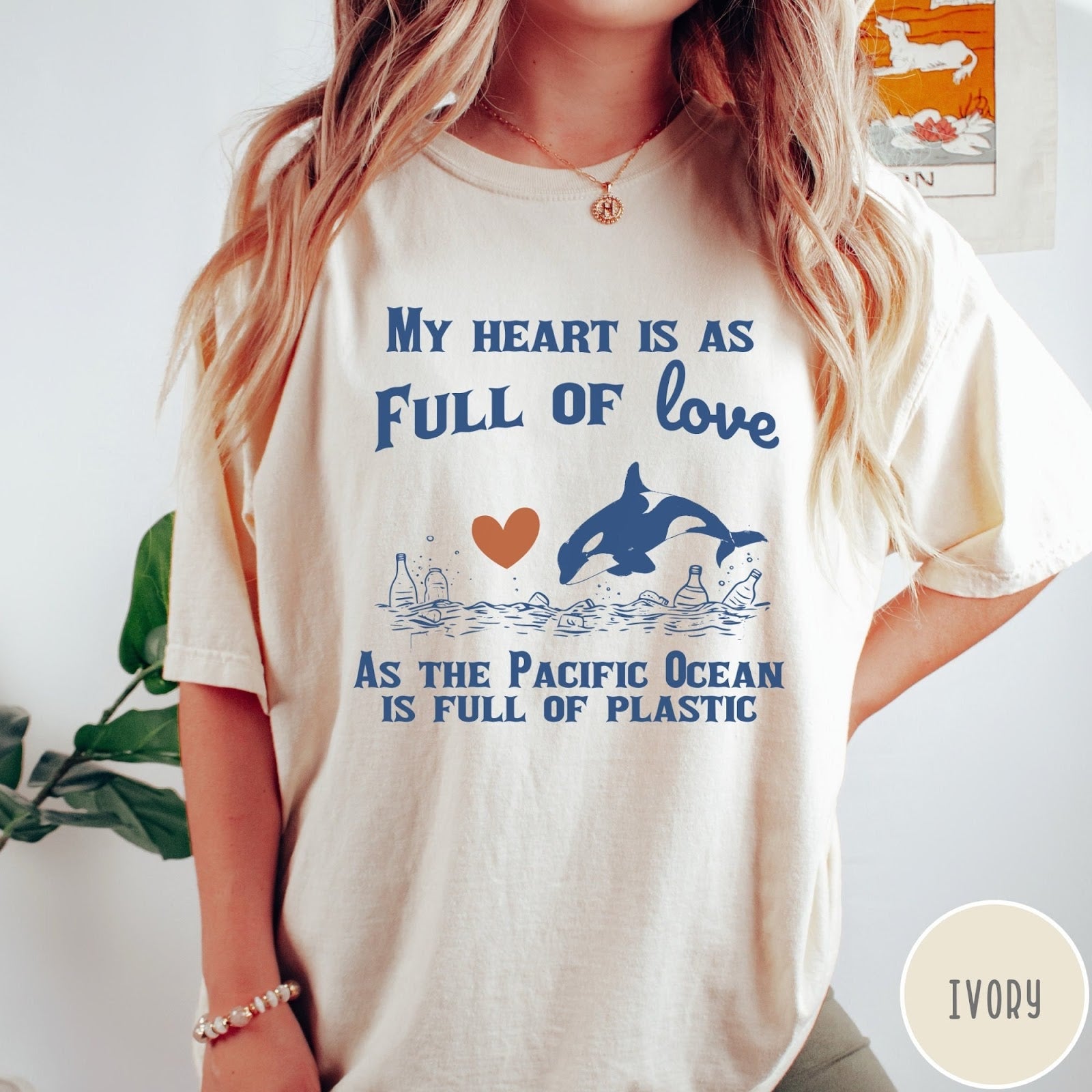 Comfort Colors tee in Ivory featuring screen printed orca and plastic pollution graphic with ocean conservation text