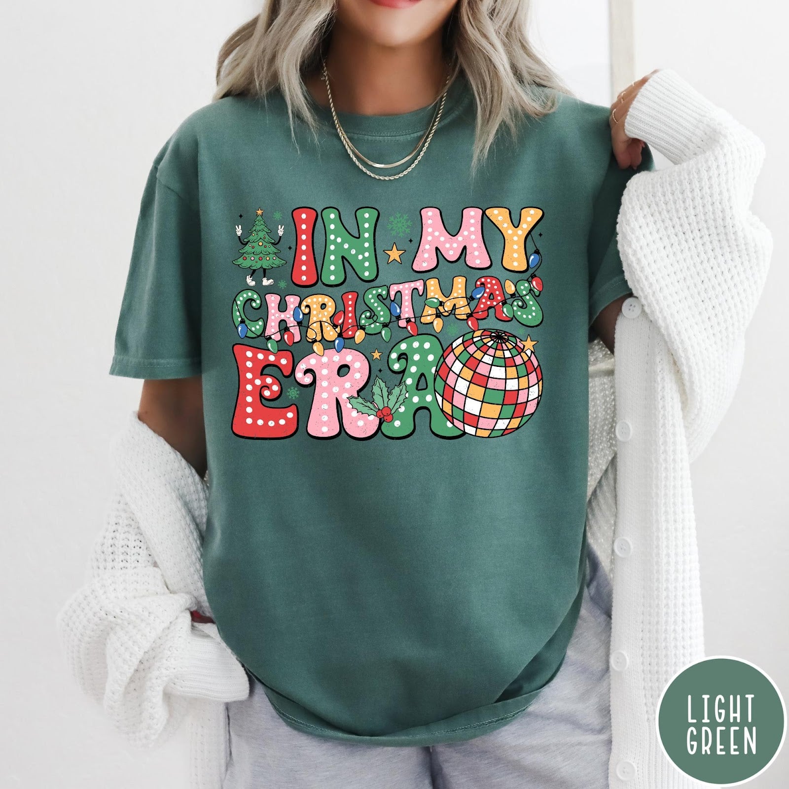 Comfort Colors tee in Light Green featuring Christmas disco style graphic with festive tree and colorful disco ball