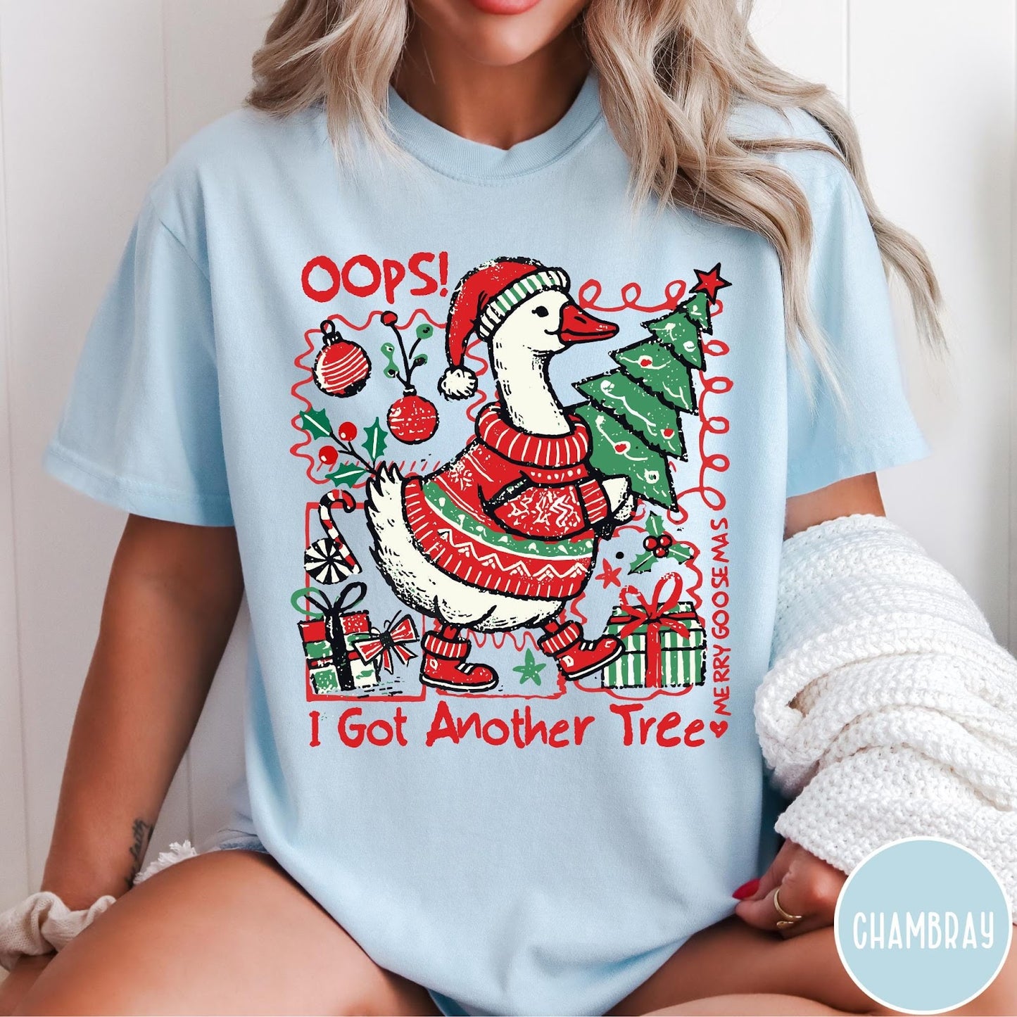 Comfort Colors tee in Chambray featuring festive graphic design of a goose wearing a sweater and hat