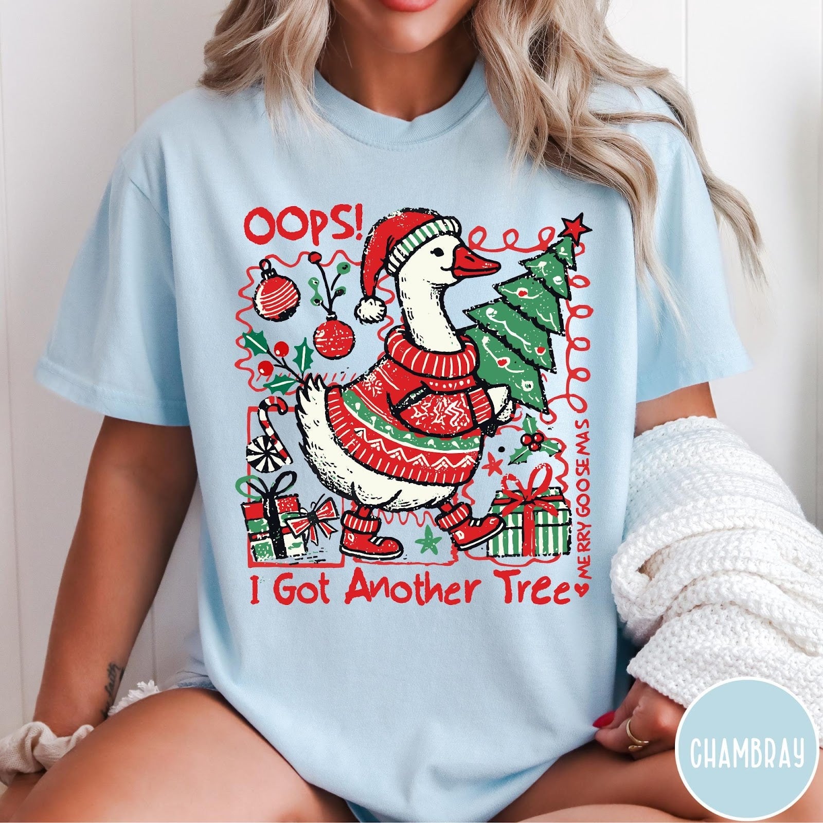 Comfort Colors tee in Chambray featuring festive graphic design of a goose wearing a sweater and hat