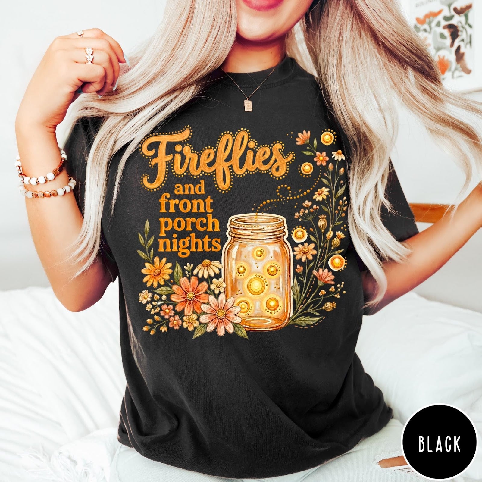 Comfort Colors tee in Black featuring rustic style graphic of fireflies in a mason jar with wildflowers