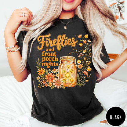 Comfort Colors tee in Black featuring rustic style graphic of fireflies in a mason jar with wildflowers