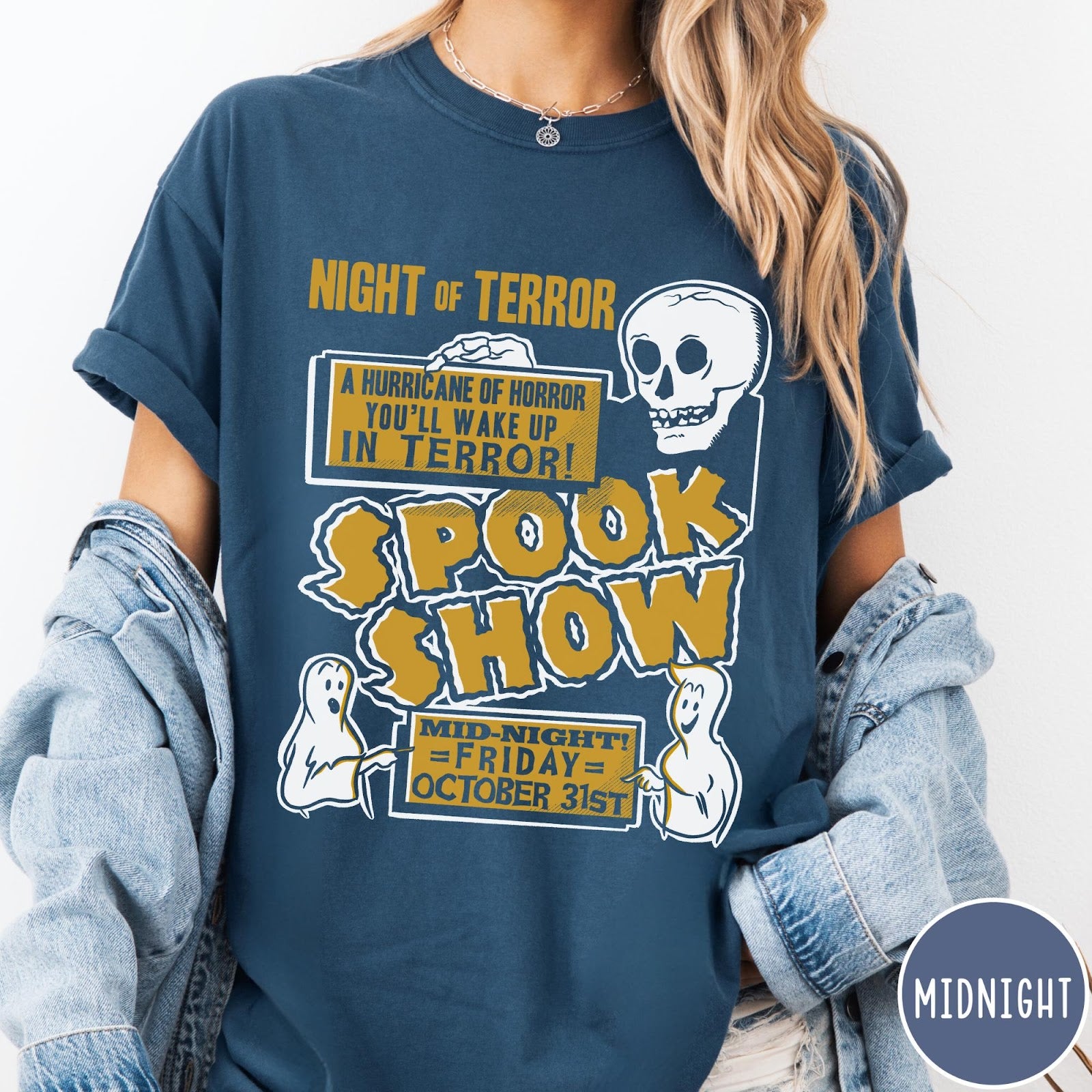 Comfort Colors tee in Midnight featuring retro horror movie poster graphic with skull and spooky ghost illustrations