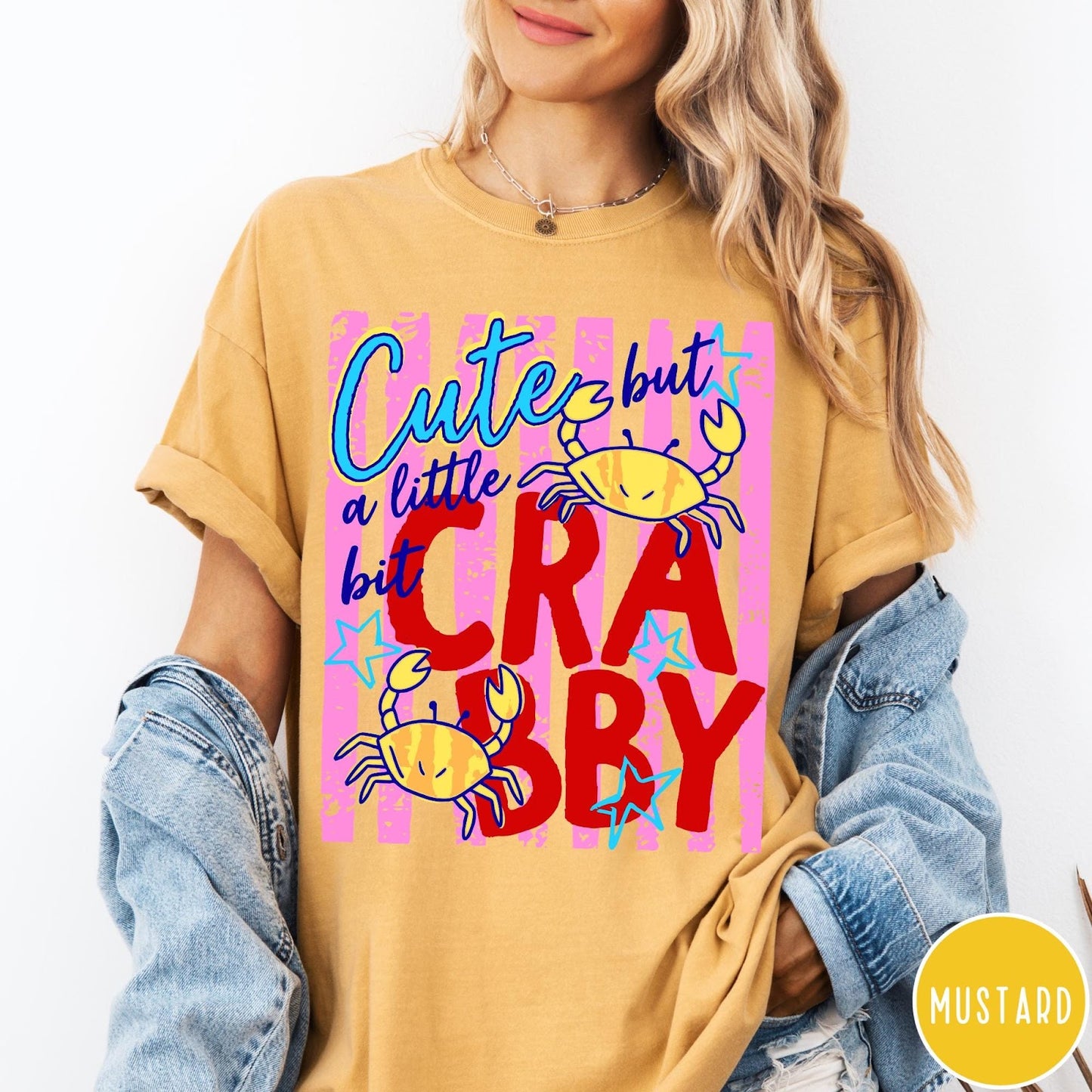 Comfort Colors tee in Mustard featuring graphic design with crabs and text reading Cute but a little bit Crabby