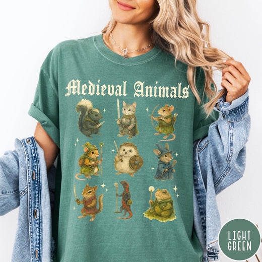 Comfort Colors tee in Light Green featuring medieval fantasy style graphic of nine various animals in knightly attire