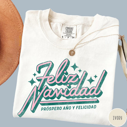 Comfort Colors tee in Ivory featuring retro Christmas style Feliz Navidad greeting with stars and holiday text