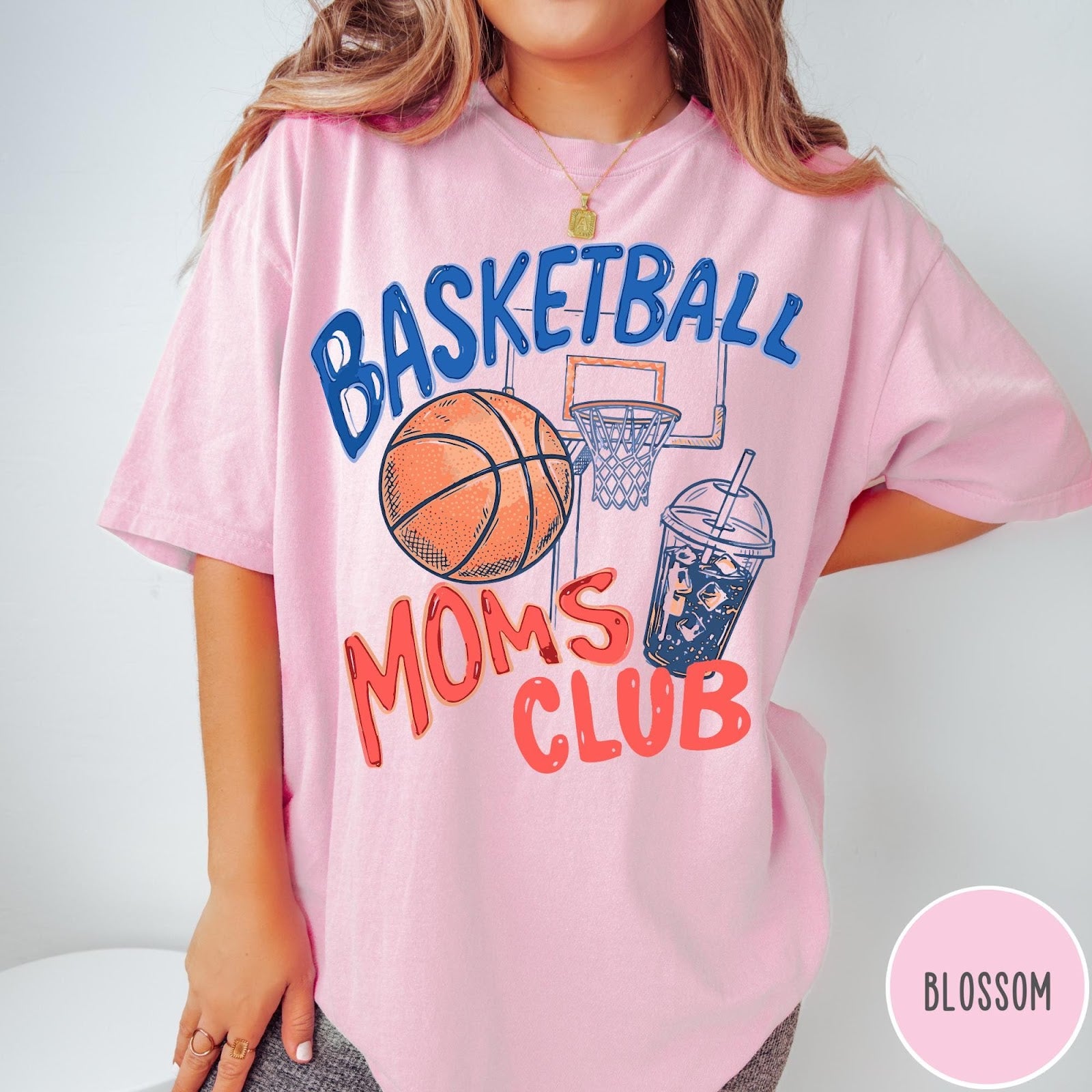 Comfort Colors tee in Blossom featuring basketball mom life graphic with basketball, hoop, and iced coffee