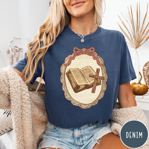 Comfort Colors tee in Denim featuring vintage style graphic of an open Bible and wooden cross