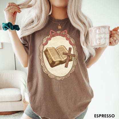 Comfort Colors tee in Espresso featuring vintage style graphic of an open Bible and wooden Christian cross.