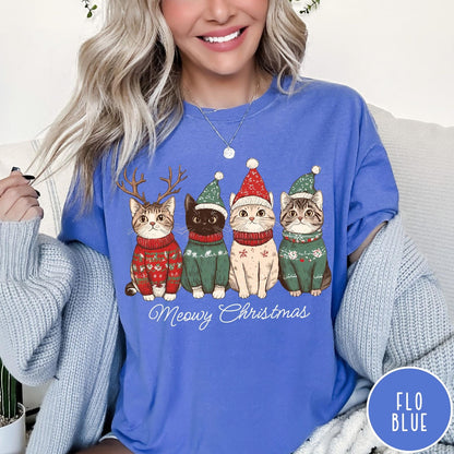 Comfort Colors tee in Flo Blue featuring holiday graphic of four cats wearing Christmas sweaters and hats