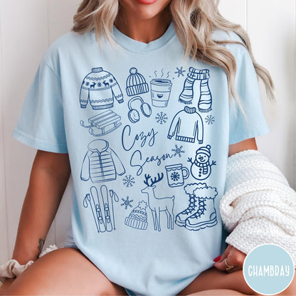 Comfort Colors tee in Chambray featuring line art winter activities and seasonal items graphic design