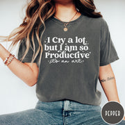 Comfort Colors tee in Pepper featuring mental health humor graphic text I Cry but Productive