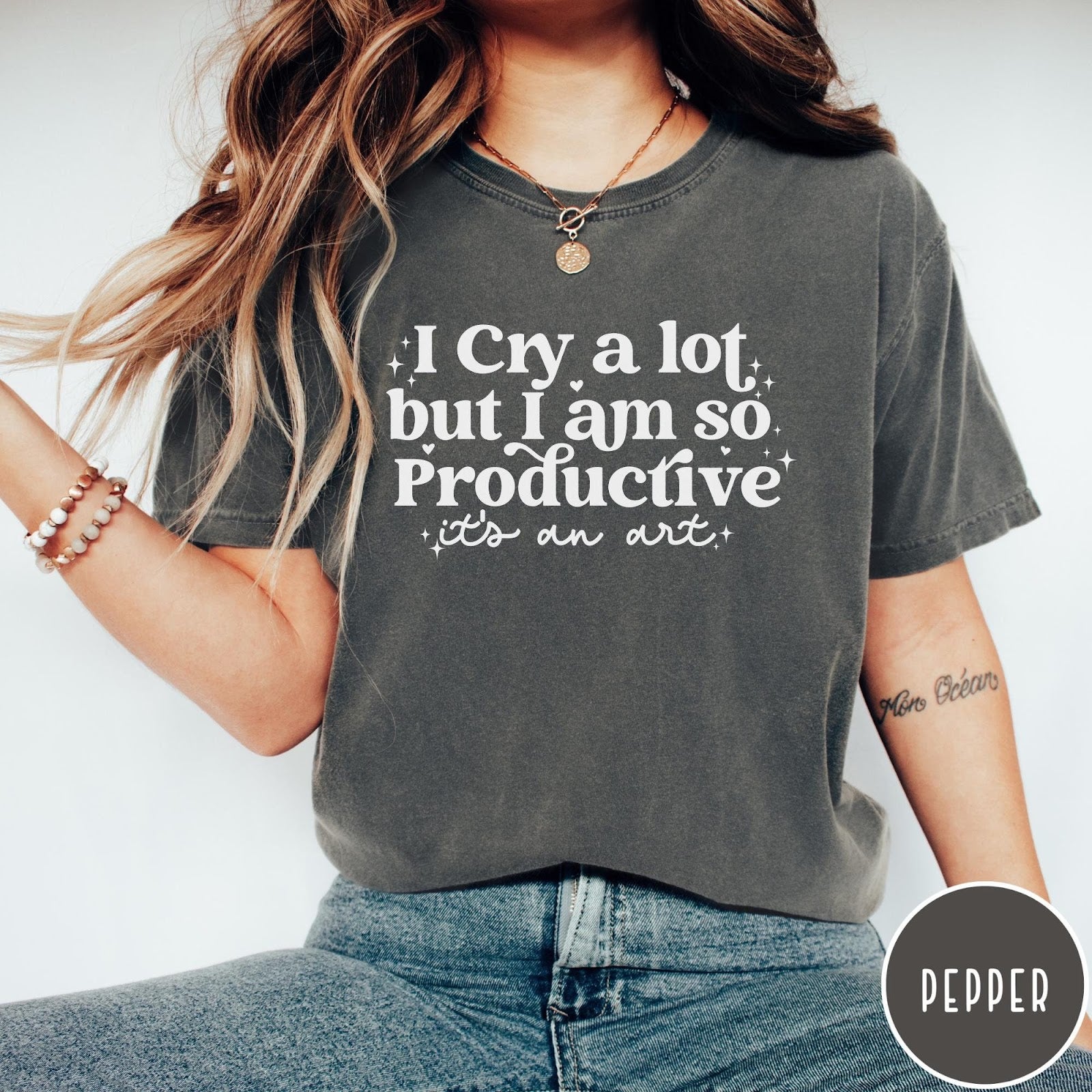 Comfort Colors tee in Pepper featuring mental health humor graphic text I Cry but Productive