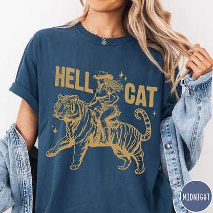 Comfort Colors tee in Midnight featuring western style graphic of a cowgirl riding a large tiger