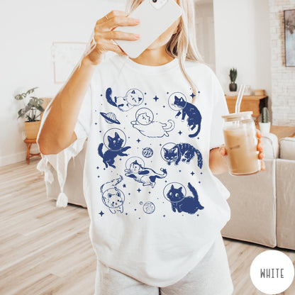 Comfort Colors tee in White featuring whimsical space style graphic with multiple cats floating in space helmets