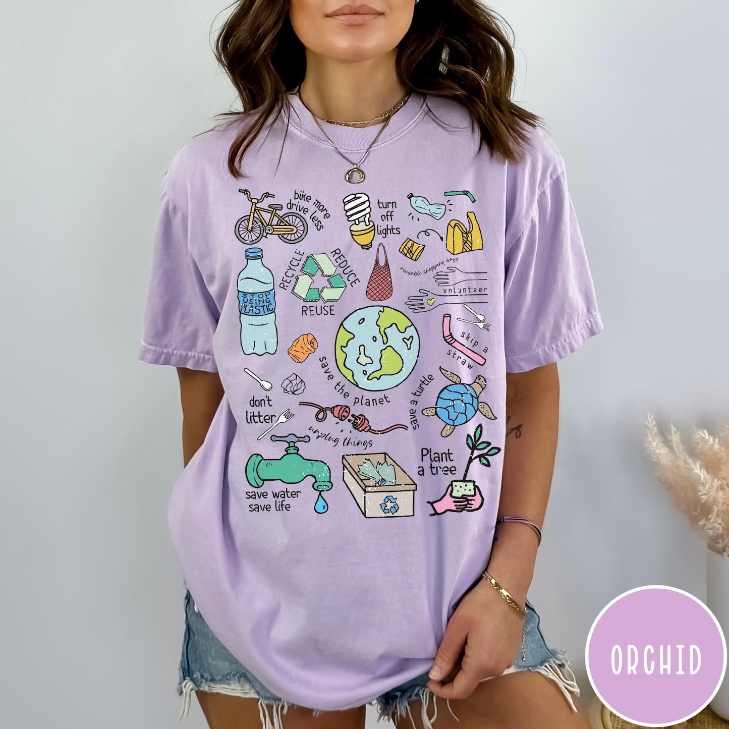 Comfort Colors tee in Orchid featuring environmental awareness graphic with icons for recycling, saving water, and nature.