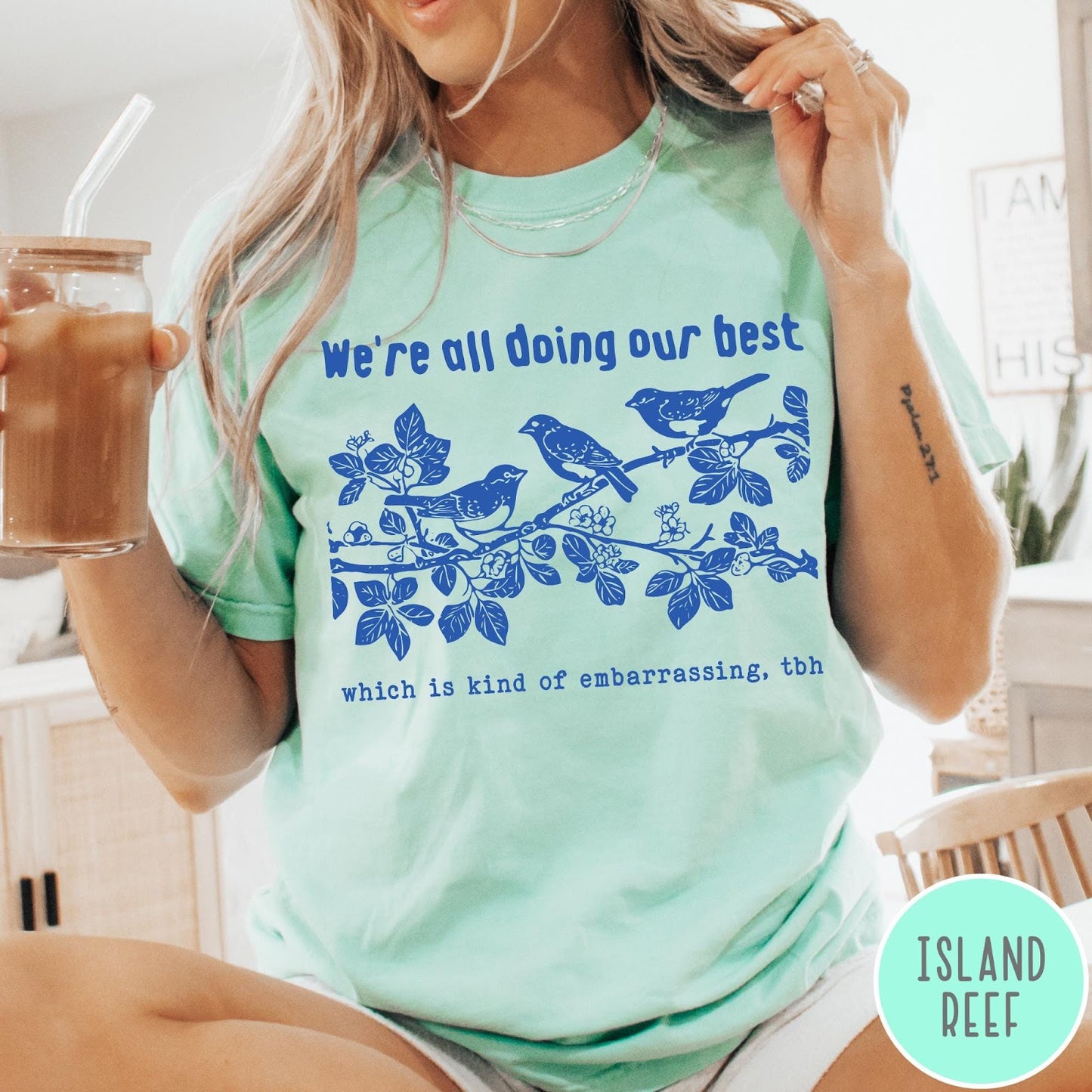 Comfort Colors tee in Island Reef featuring graphic illustration of birds on a branch with text.