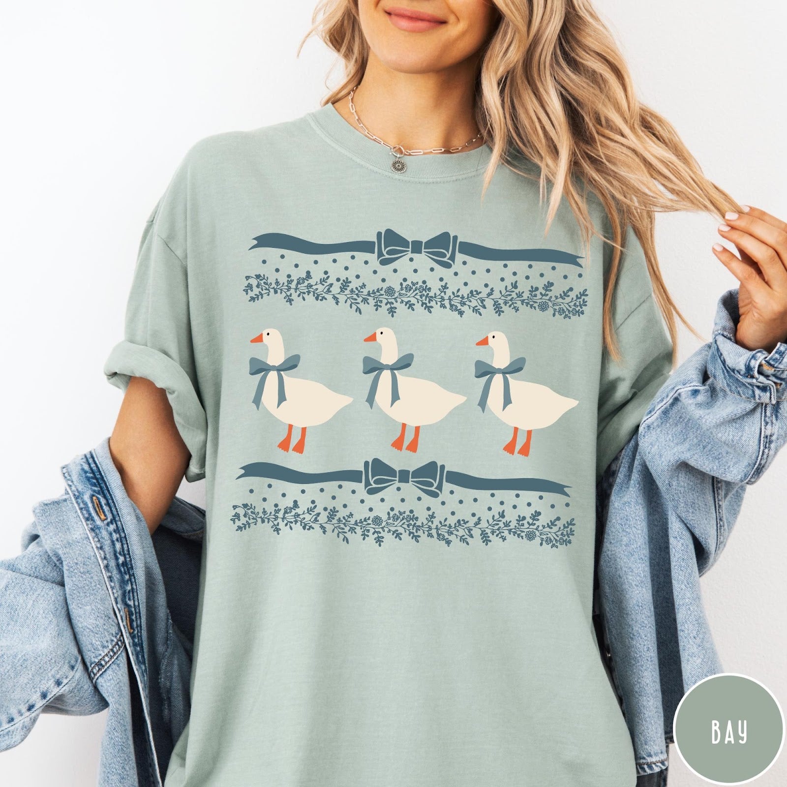Comfort Colors tee in Bay featuring vintage style graphic with three geese wearing blue ribbons and floral borders