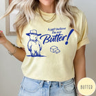 Comfort Colors tee in Butter featuring bear graphic with cowboy hat and text I can't believe I'm not Butter