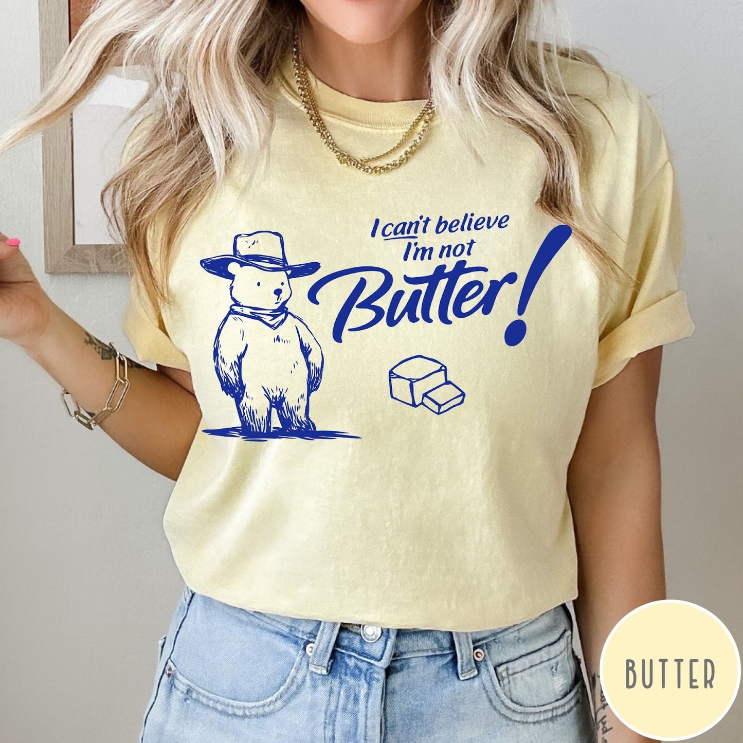 Comfort Colors tee in Butter featuring bear graphic with cowboy hat and text I can't believe I'm not Butter