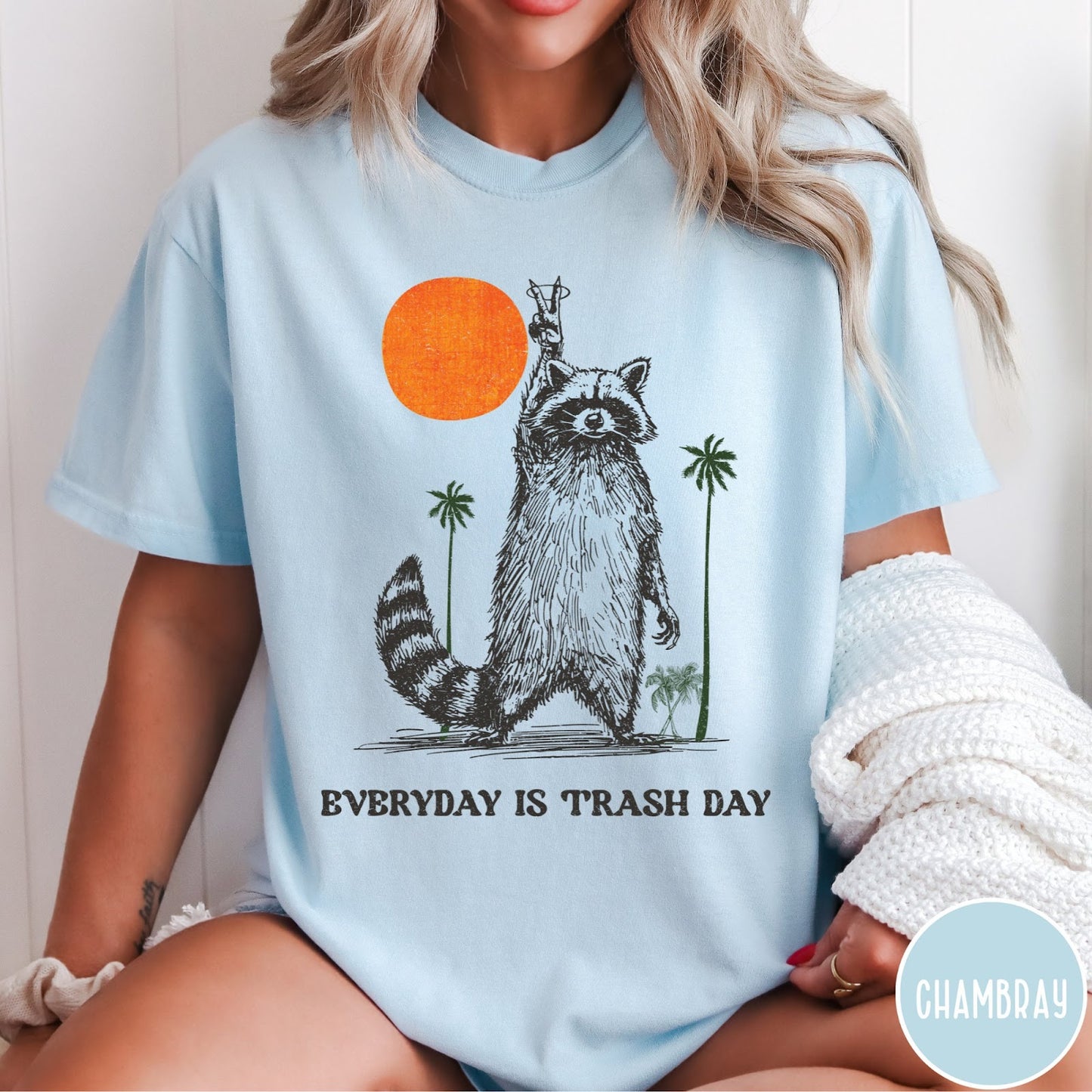 Comfort Colors tee in Chambray featuring vintage style graphic of a raccoon making a peace sign