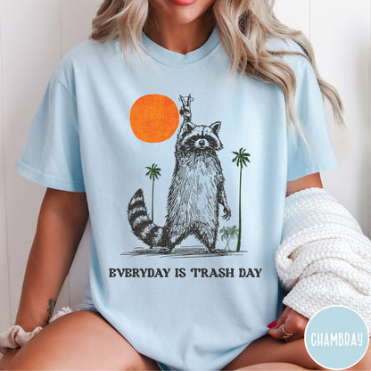Comfort Colors tee in Chambray featuring vintage style graphic of a raccoon making a peace sign