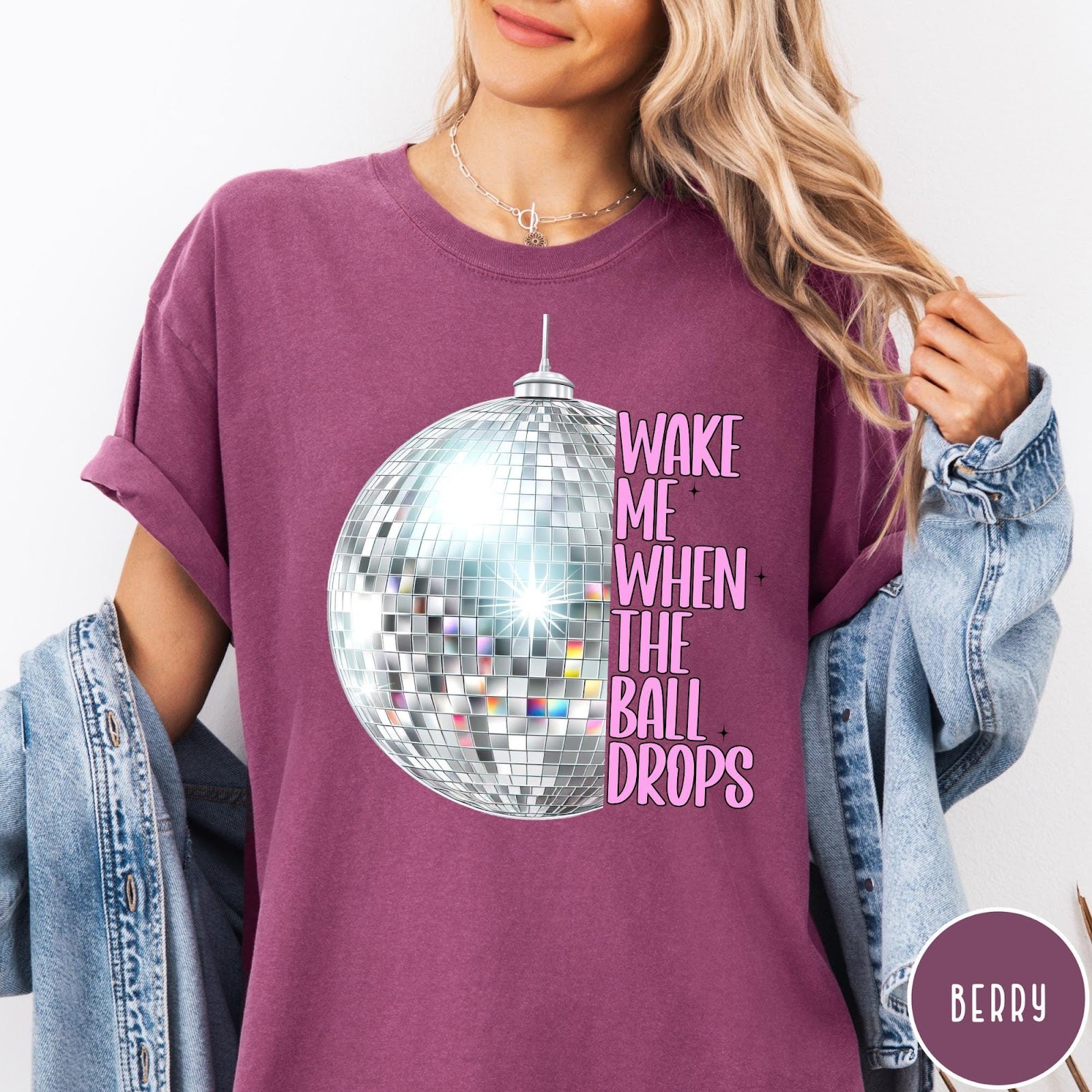 Comfort Colors tee in Berry featuring disco ball graphic and pink text reading Wake Me When The Ball Drops