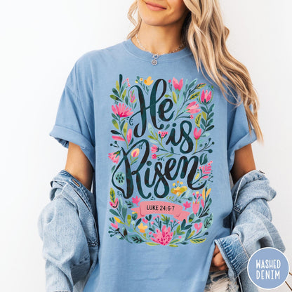Comfort Colors tee in Washed Denim featuring religious floral design with He is Risen text graphic