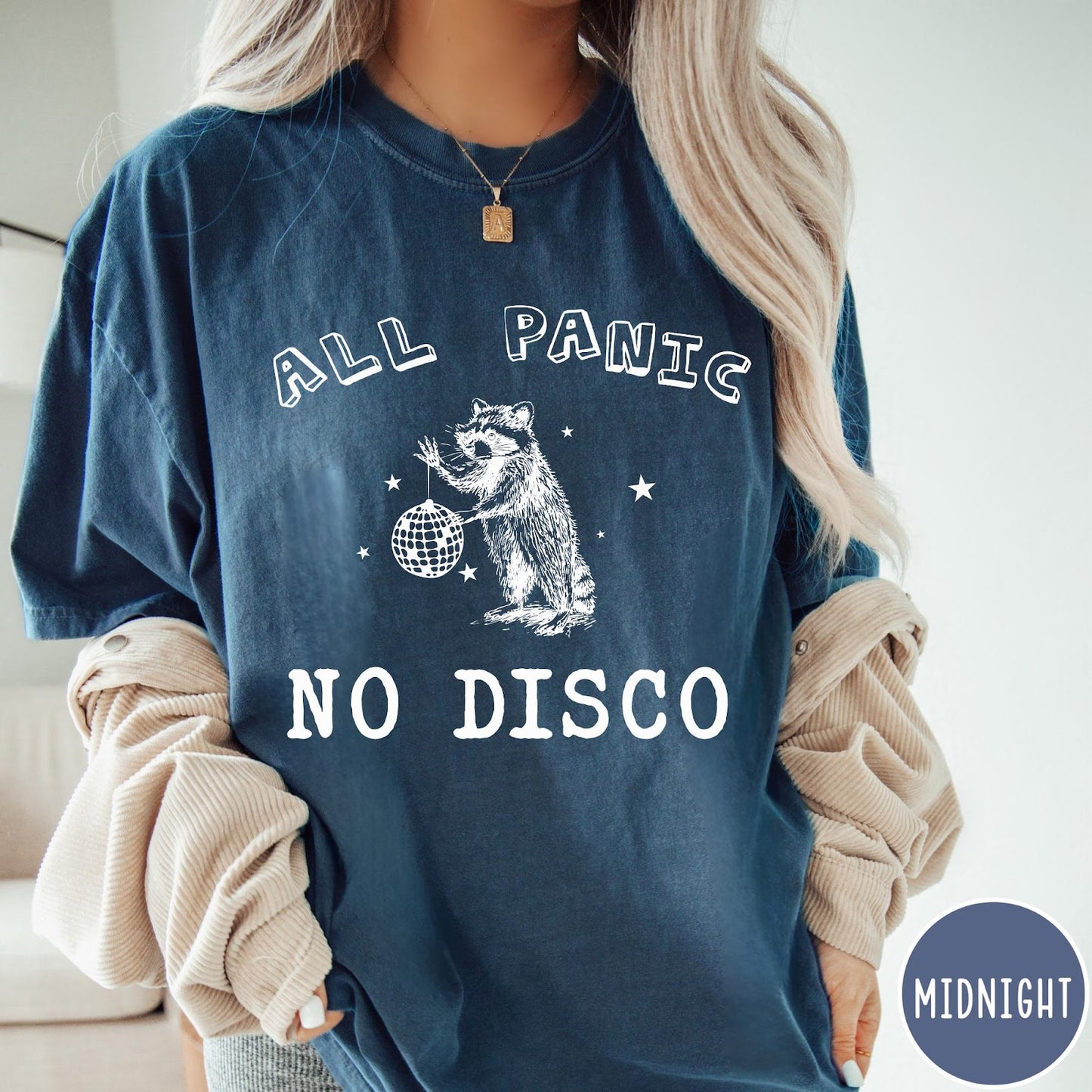 Comfort Colors tee in Midnight featuring screen printed raccoon graphic holding a disco ball with star accents
