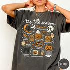 Comfort Colors tee in Pepper featuring Halloween icons collage with witch, skull, pumpkin, and spooky fall graphics