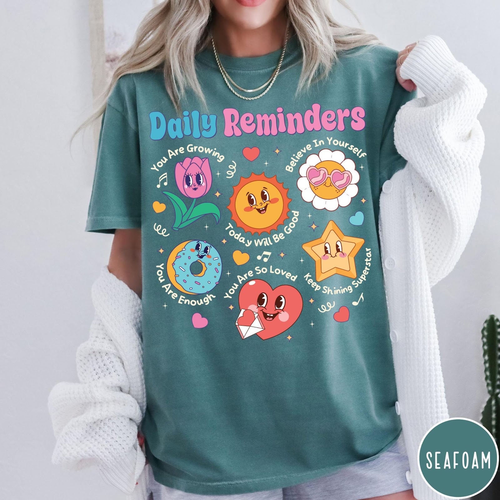 Comfort Colors tee in Seafoam featuring retro mascot graphic with daily affirmations and cute cartoon characters