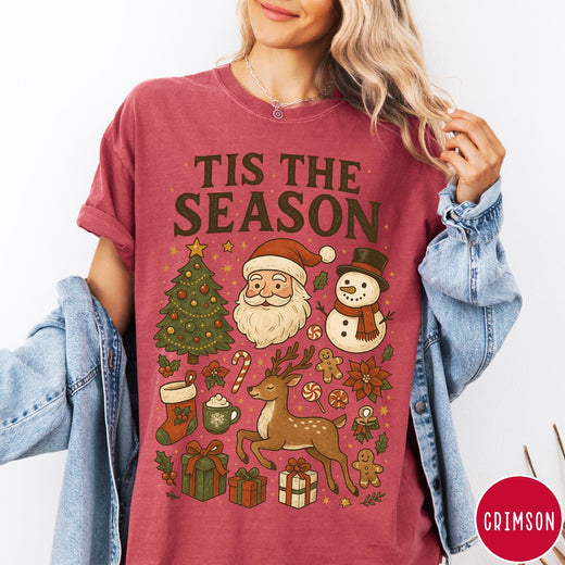 Comfort Colors tee in Crimson featuring Christmas collage graphic with Santa, snowman, reindeer, and holiday gifts