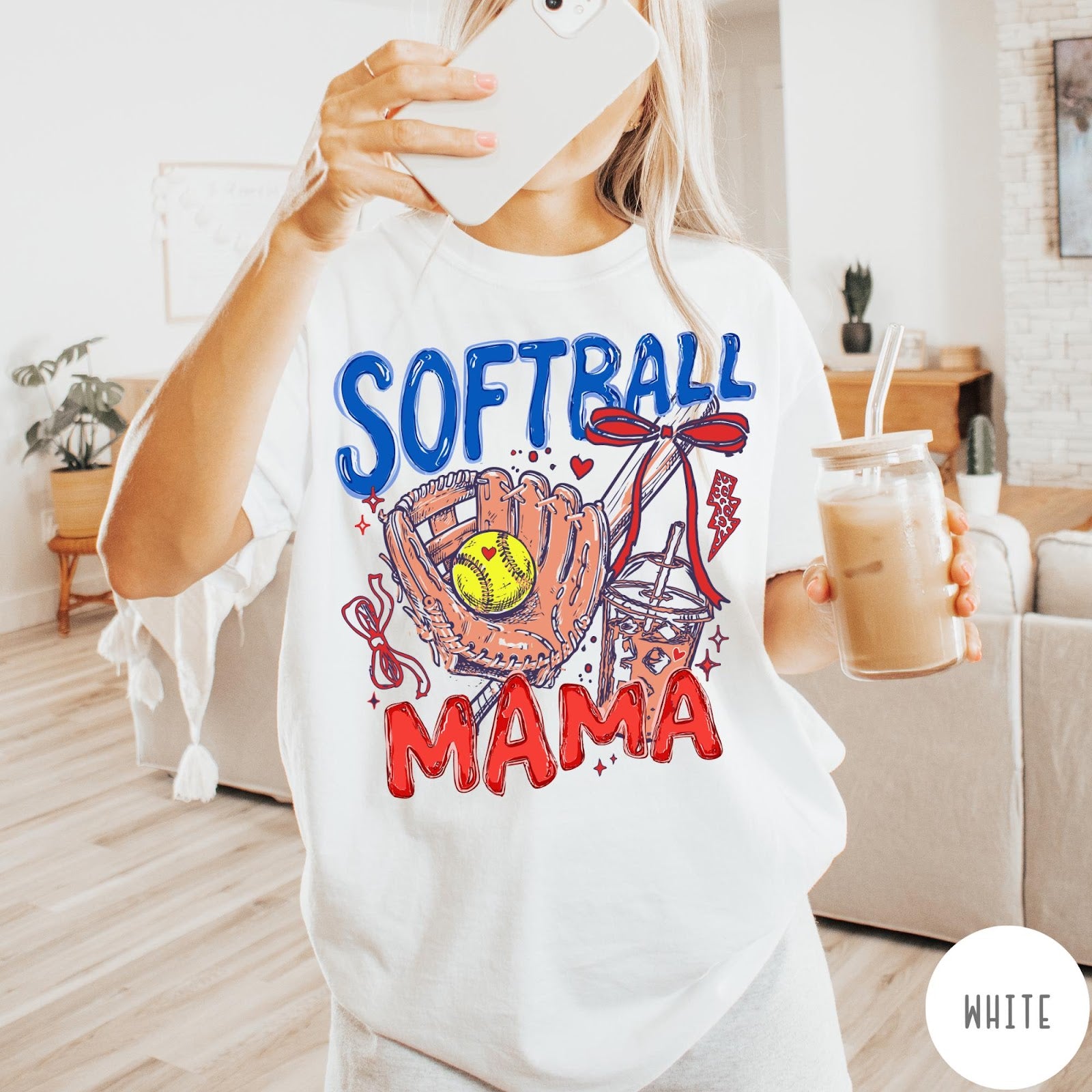 Comfort Colors tee in White featuring softball mom graphic with glove, ball, bat, and iced coffee design