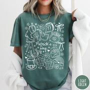 Comfort Colors tee in Light Green featuring white line art style St. Patrick's Day icons including shamrocks and leprechaun hat