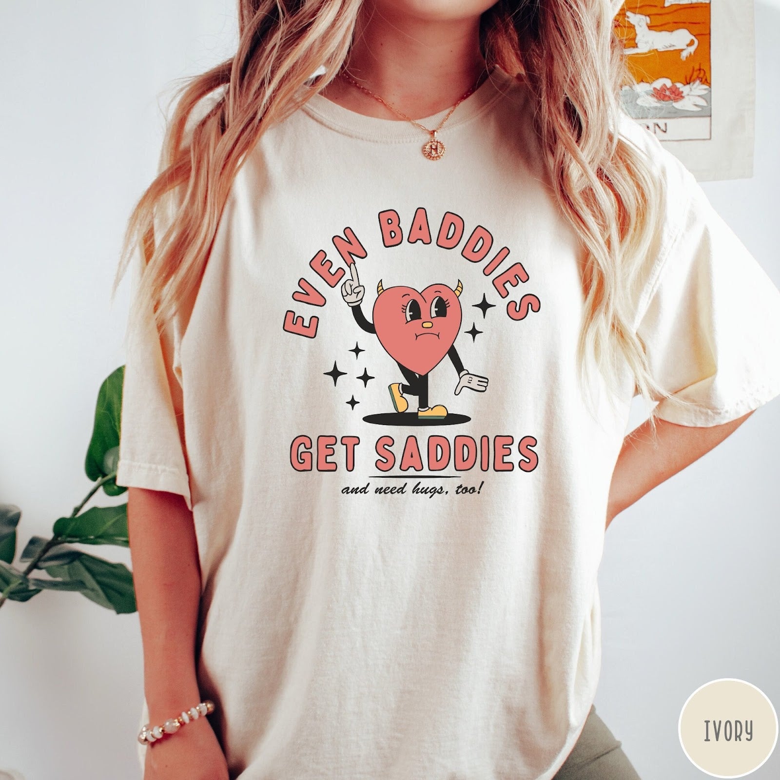Comfort Colors tee in Ivory featuring retro style graphic of a sad heart character with devil horns
