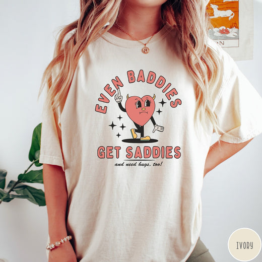 Comfort Colors tee in Ivory featuring retro style graphic of a sad heart character with devil horns