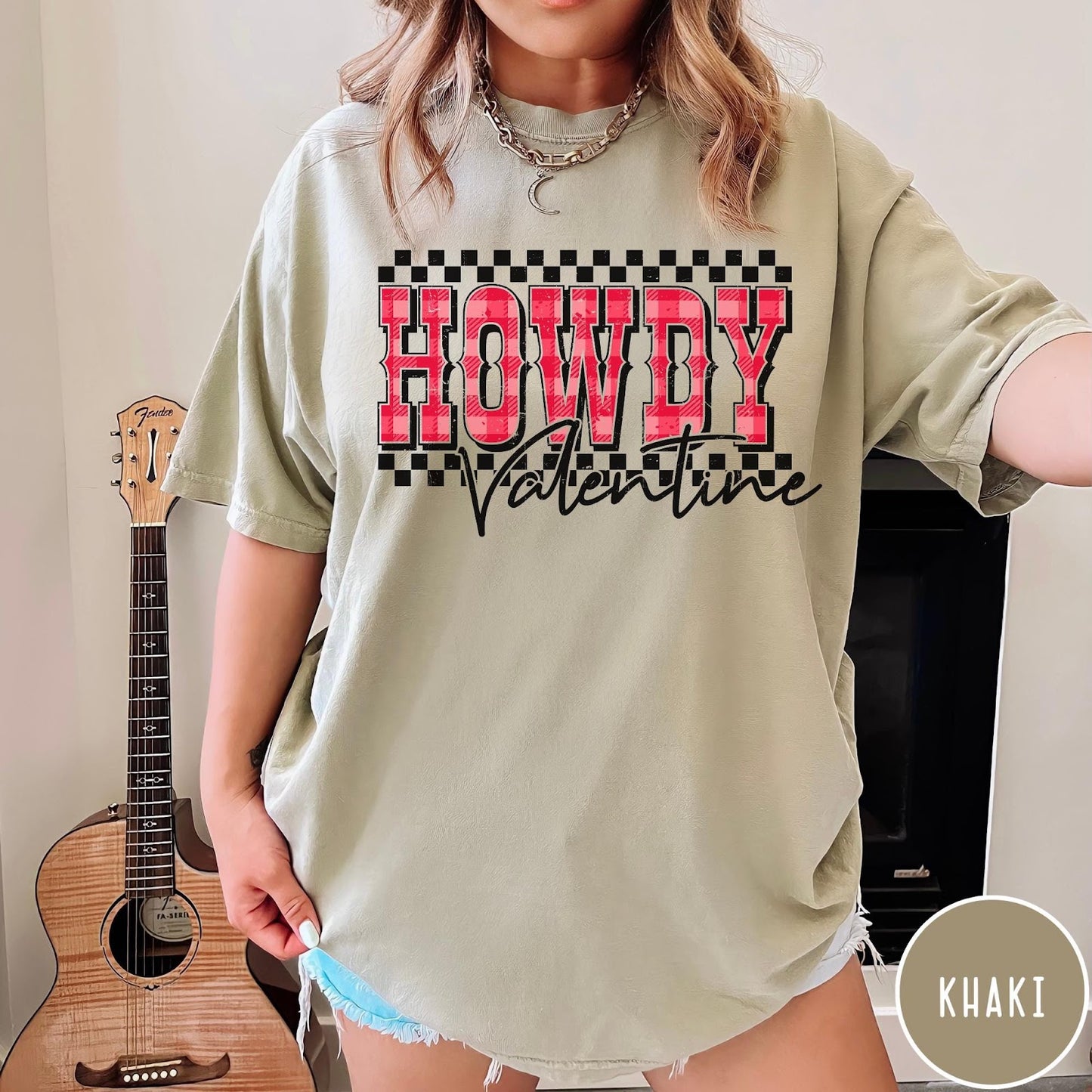 Comfort Colors tee in Khaki featuring western Valentine greeting with Howdy Valentine text and checkered border graphic