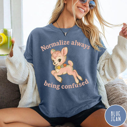Comfort Colors tee in Blue Jean featuring vintage style fawn graphic with flowers and Normalize Always Being Confused text