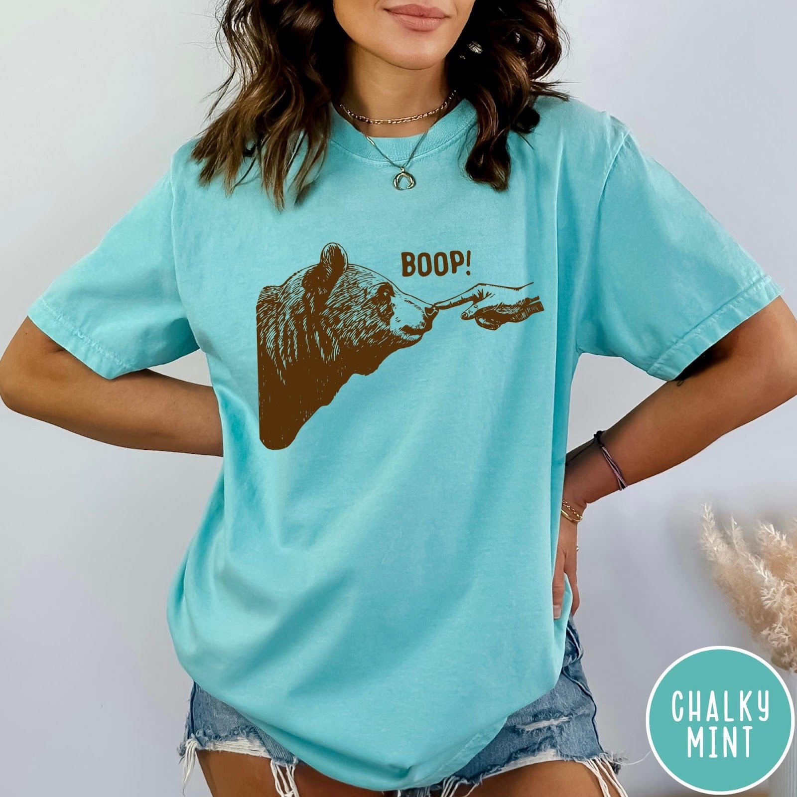 Comfort Colors tee in Chalky Mint featuring a brown ink graphic of a human finger booping a bear nose
