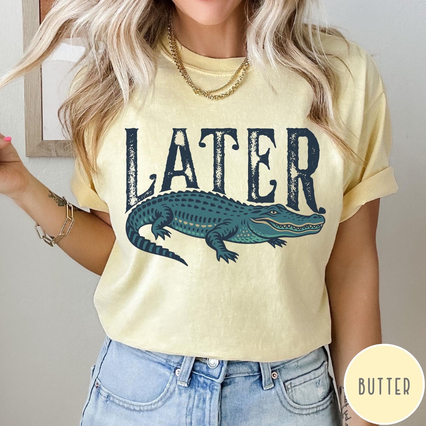 Comfort Colors tee in Butter featuring casual style with a graphic of a green alligator and text