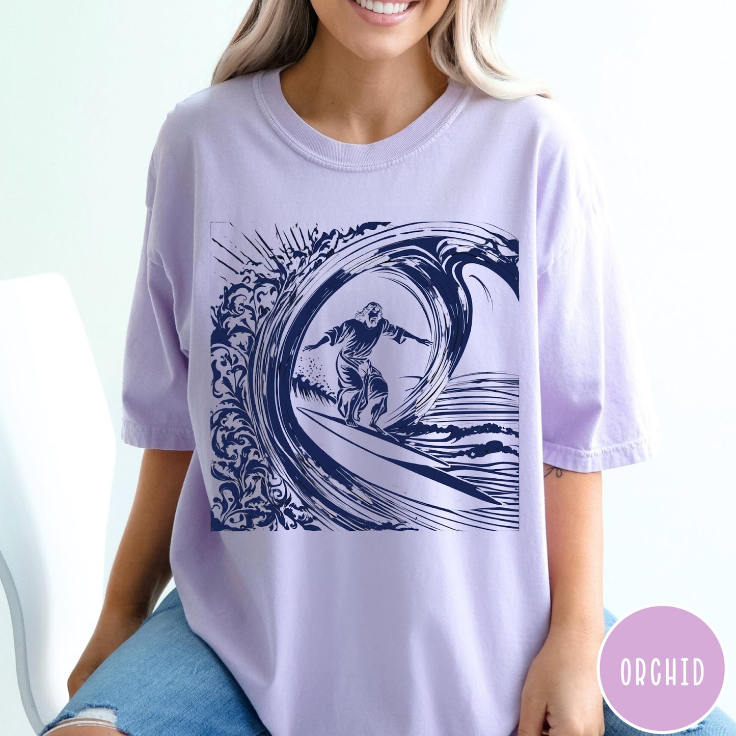 Comfort Colors tee in Orchid featuring graphic style Jesus surfing on a large ocean wave