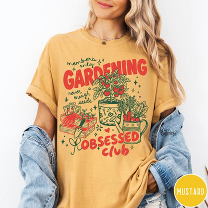 Comfort Colors tee in Mustard featuring retro graphic gardening design with plants, tools, and seeds