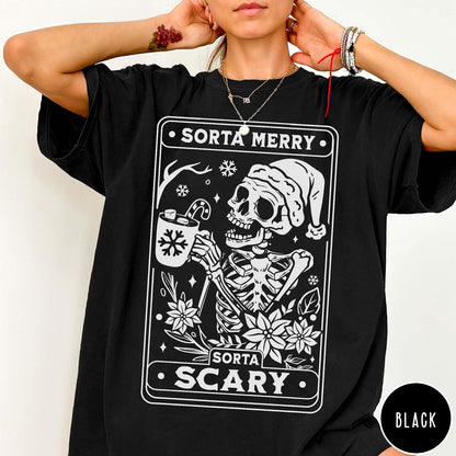Comfort Colors tee in Black featuring graphic design of a skeleton in a Santa hat holding cocoa
