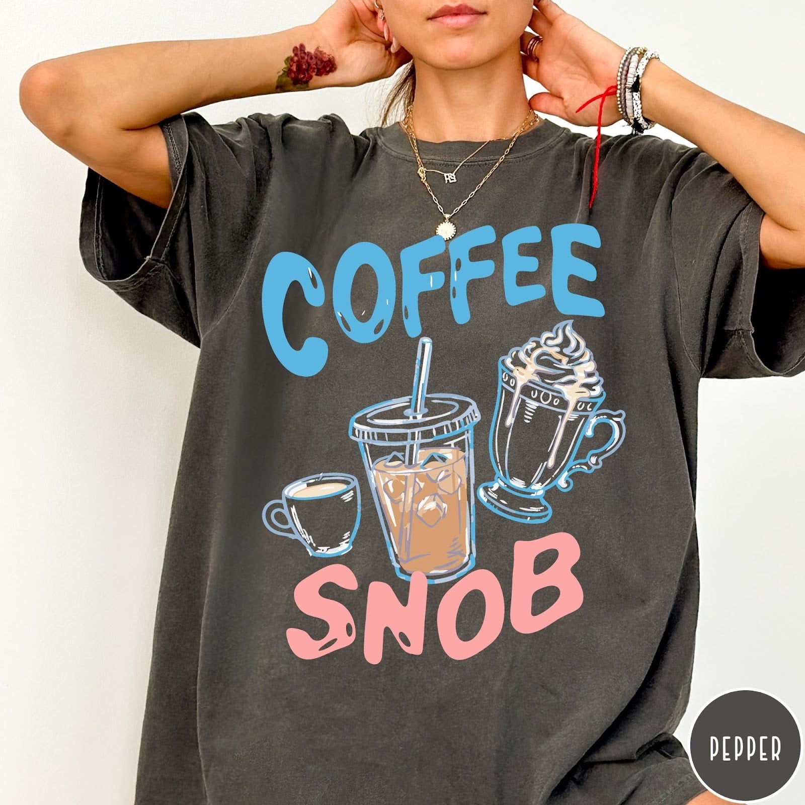 Comfort Colors tee in Pepper featuring coffee themed graphic with iced coffee, espresso, and whipped cream drinks