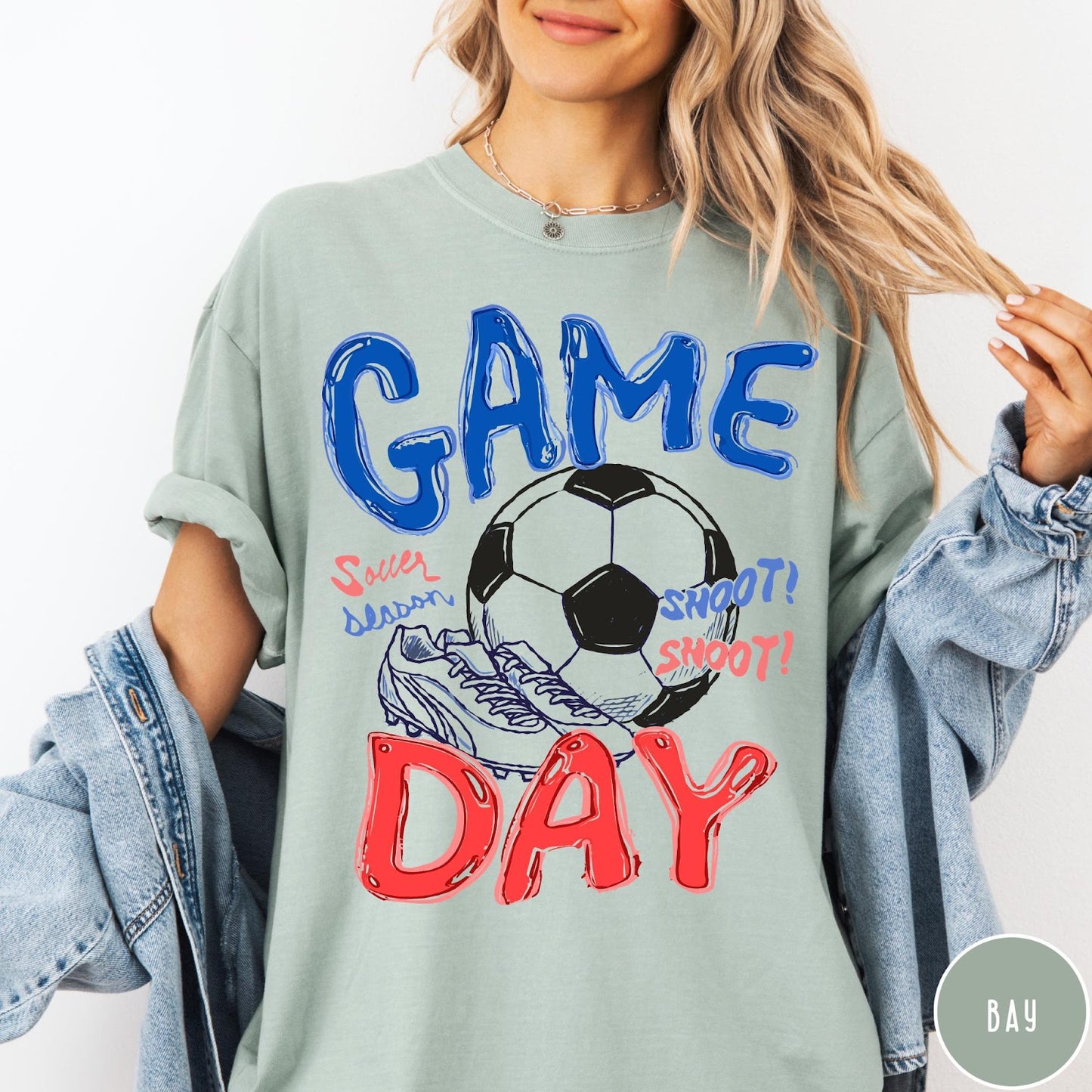 Comfort Colors tee in Bay featuring soccer graphic with ball, cleats, and Game Day typography design