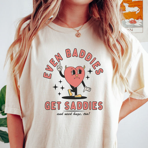 Comfort Colors tee in Ivory featuring retro style graphic of a sad heart character with devil horns