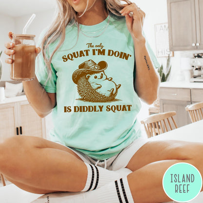 Comfort Colors tee in Island Reef featuring cute graphic style illustration of a hedgehog wearing a cowboy hat