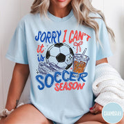 Comfort Colors tee in Chambray featuring screen print style soccer season graphic with ball and iced coffee